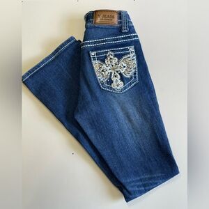 EUC Women’s denim with cross studded pockets.